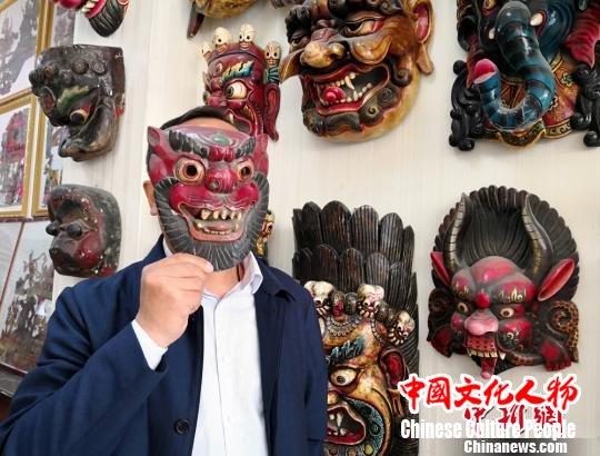 图为展示傩面具。　刘薛梅 摄